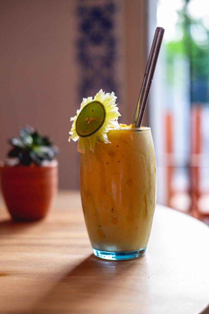 Mango smoothie against azulejo wall